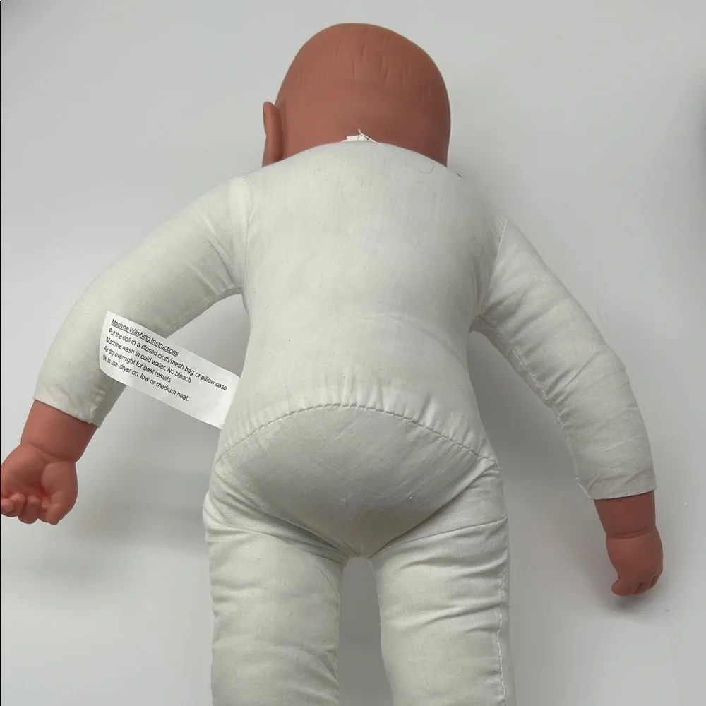 Realistic Baby Doll with White Outfit